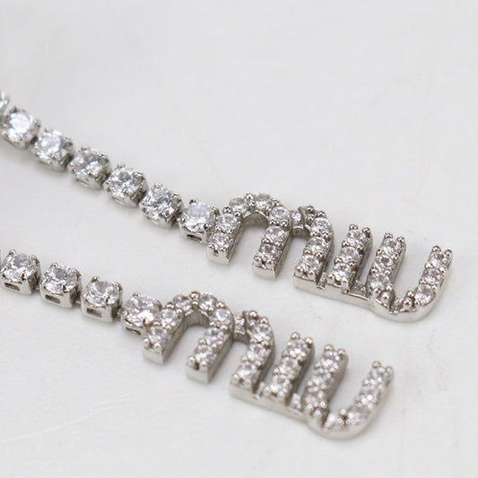 MIUMIU  5IO058 2DNC F0OKL Pierce metal Women